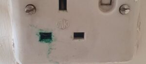 An image showing green goo at a socket